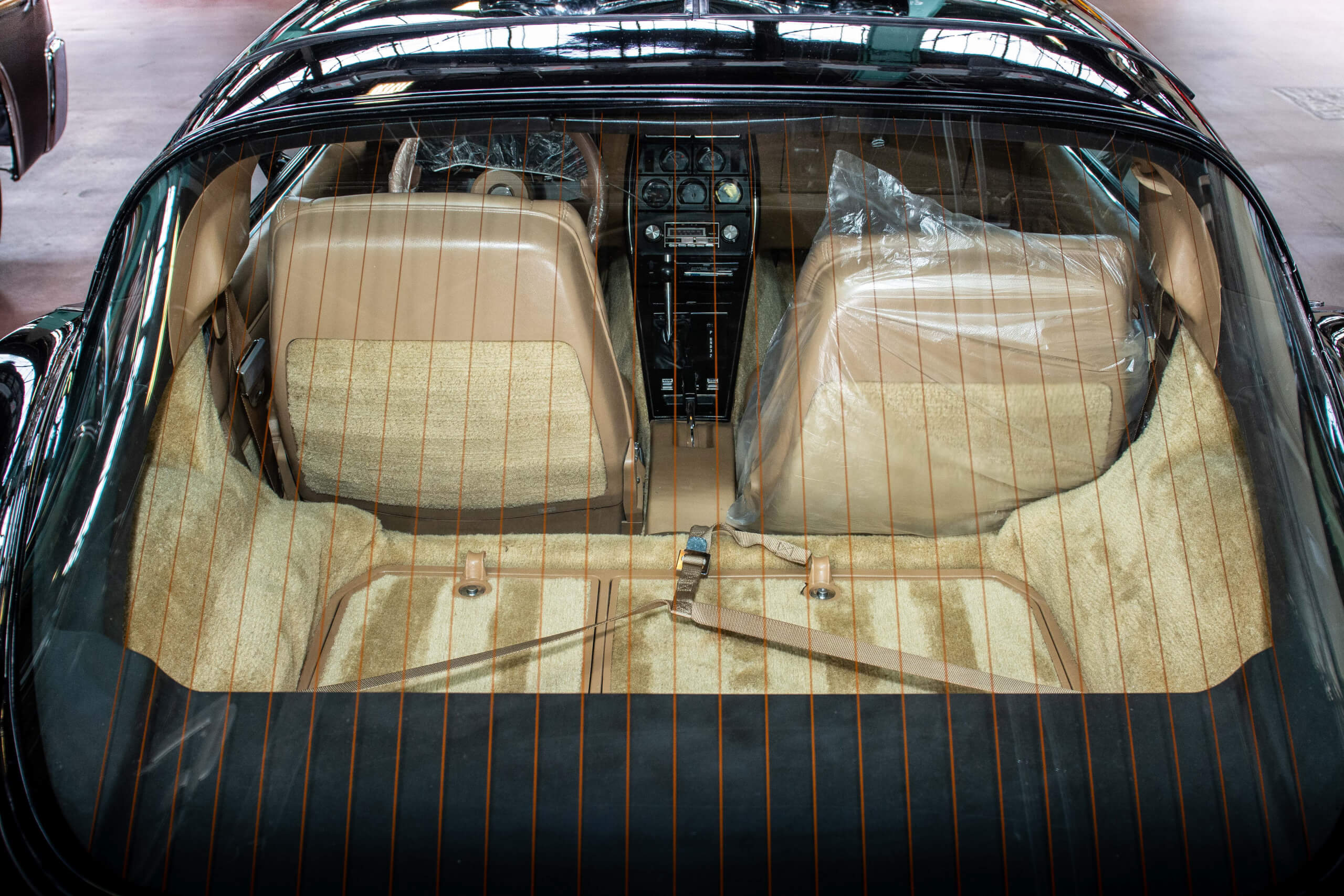 The C3 Corvette features two cargo areas behind the front seats.