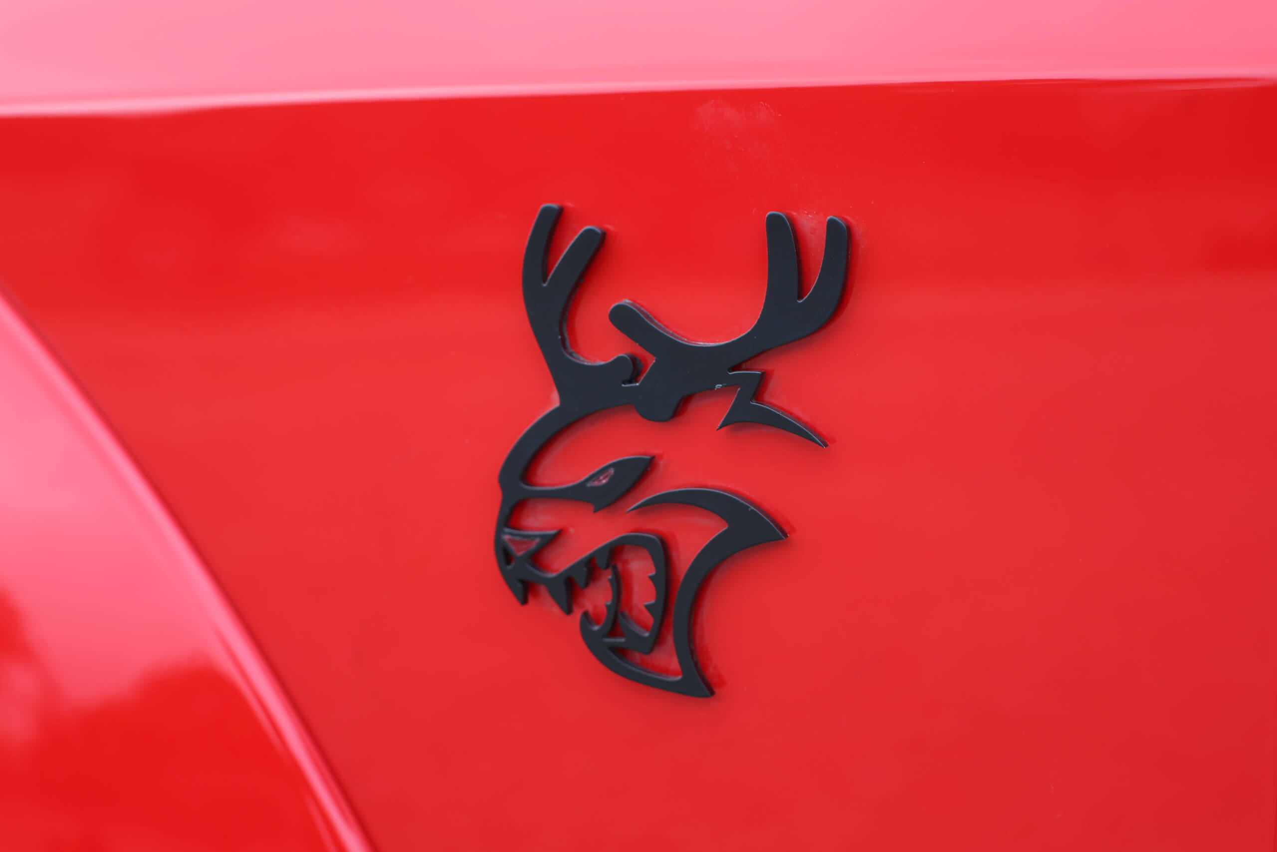 Five custom Dodge Challenger SRT Hellcat Redeyes sport custom reindeer badging.